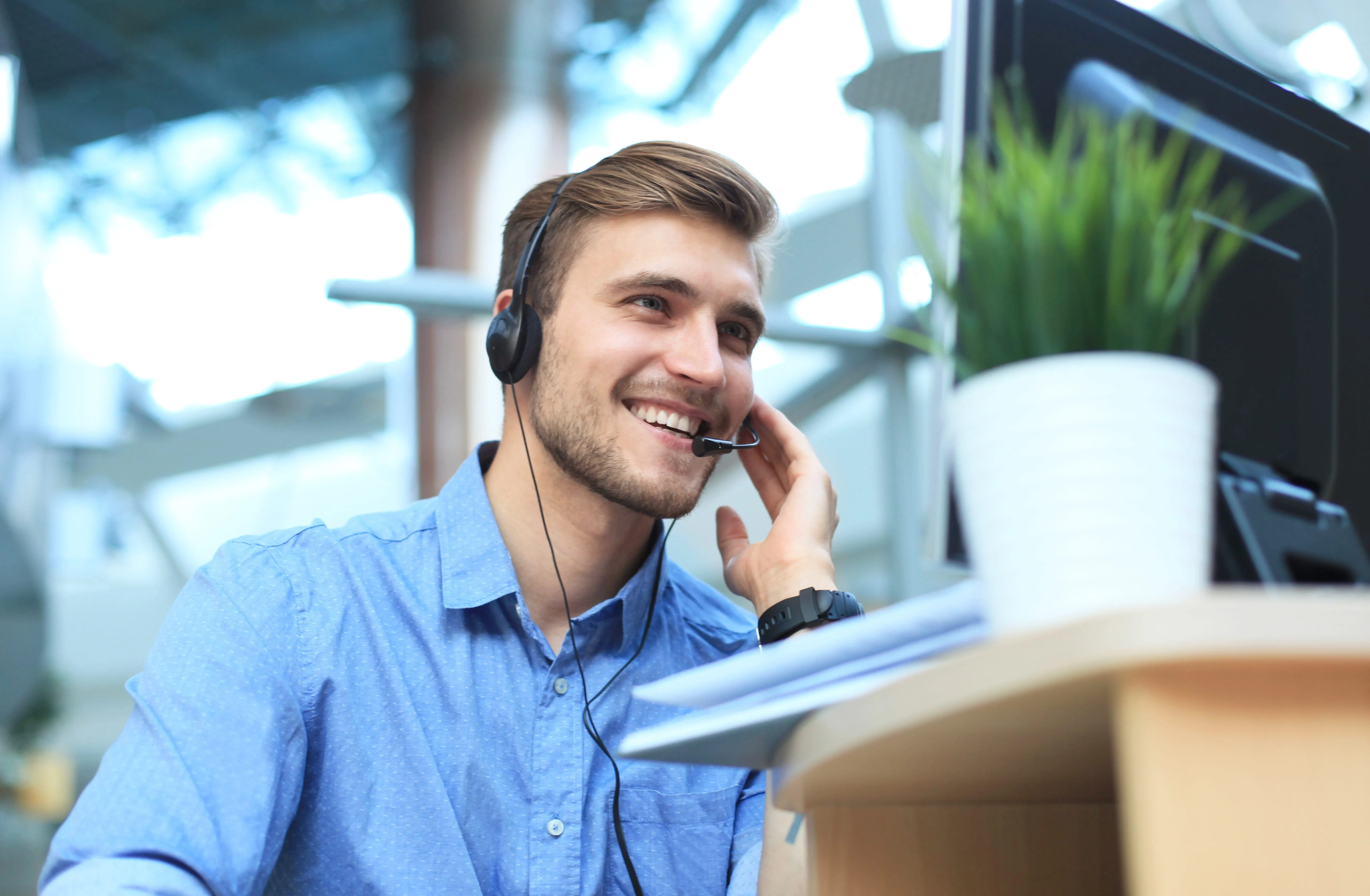 young man smiling and speaking